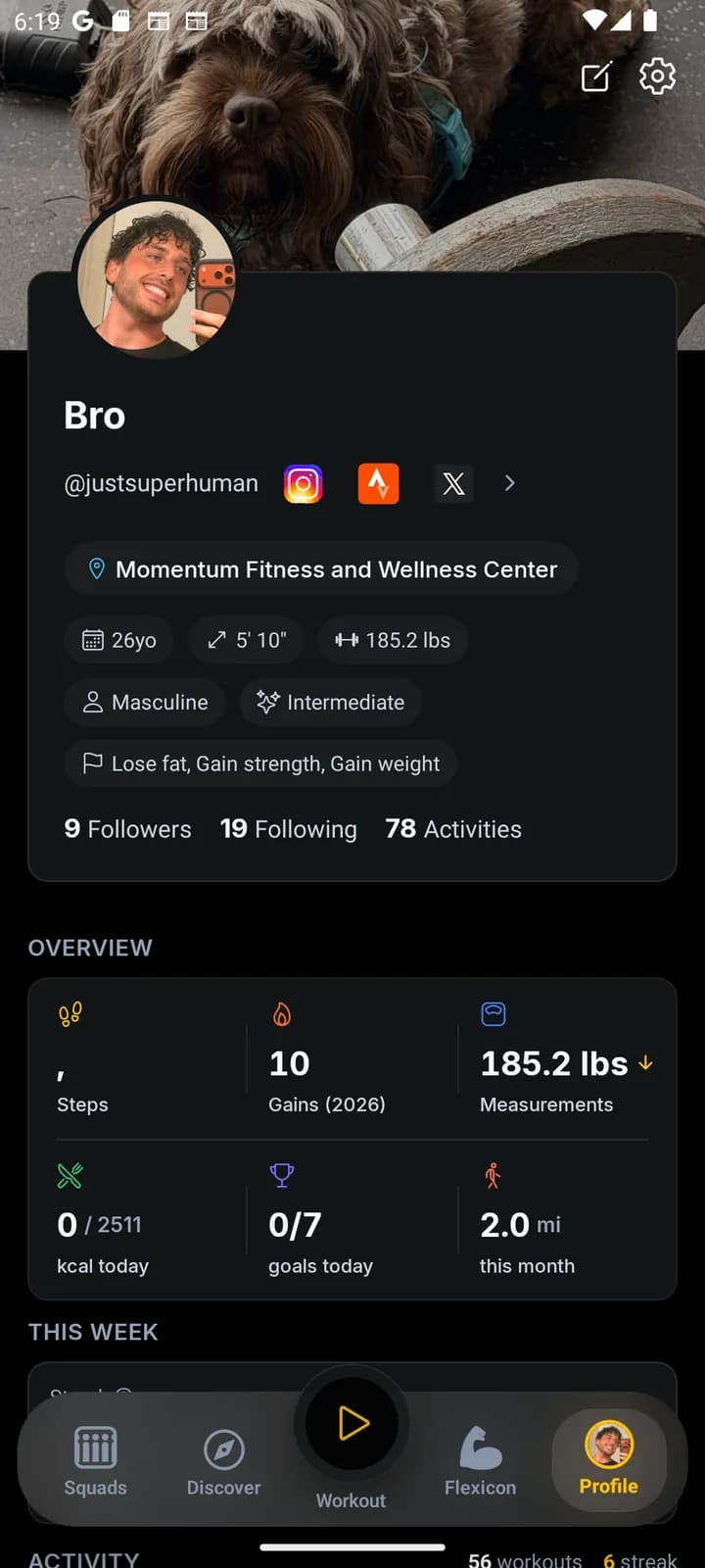 JustGains profile screen showing name, username, body stats, experience level, and training goals.